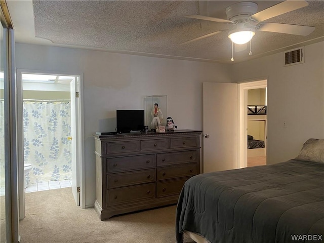 bedroom with visible vents, light colored carpet, ceiling fan, access to exterior, and a textured ceiling