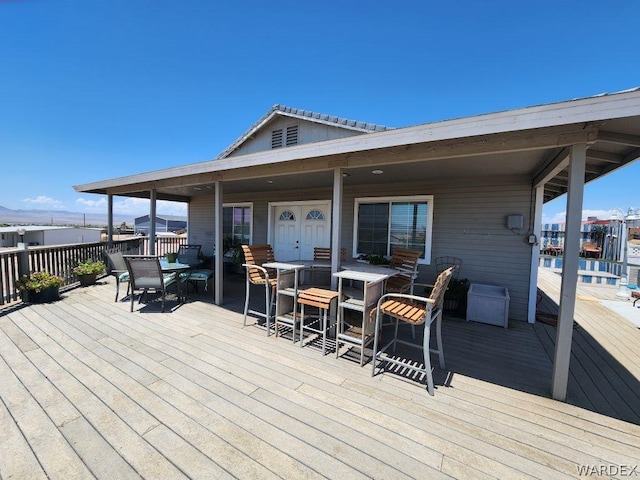 wooden deck with an outdoor bar