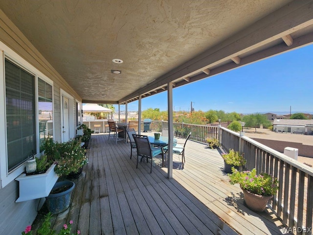 wooden deck with outdoor dining space