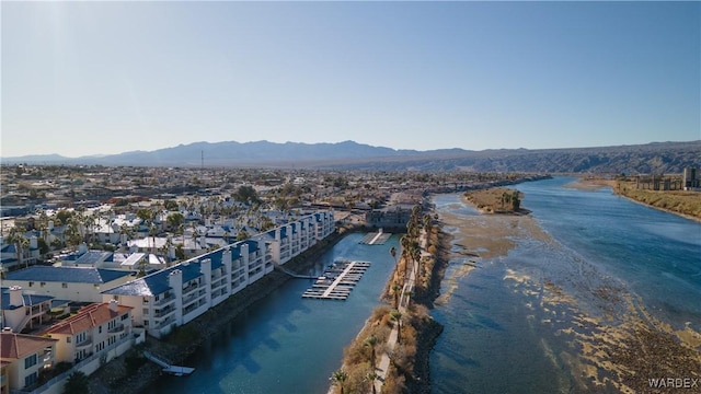 drone / aerial view with a water and mountain view