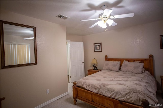 bedroom with light carpet, baseboards, visible vents, and a ceiling fan