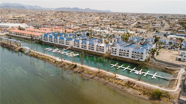 birds eye view of property featuring a residential view and a water and mountain view