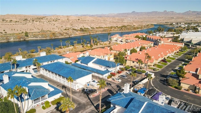 bird's eye view with a residential view and a water and mountain view