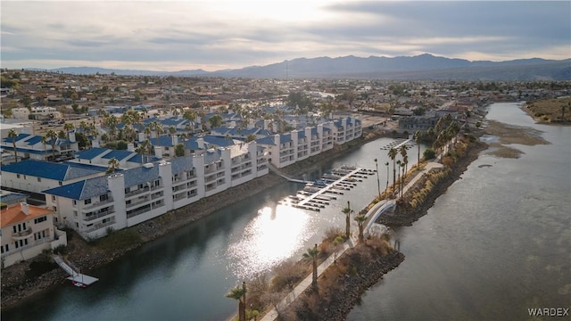 bird's eye view with a residential view and a water and mountain view