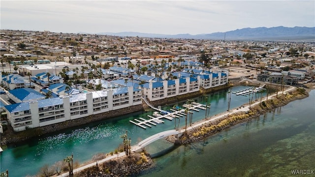 drone / aerial view with a water and mountain view