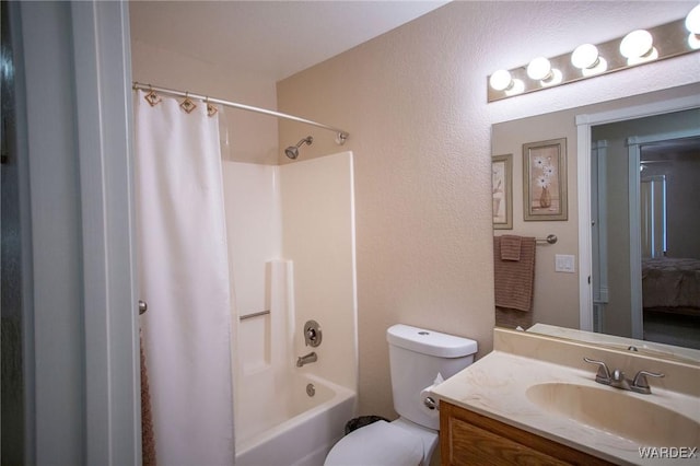 full bathroom with shower / tub combo, vanity, and toilet