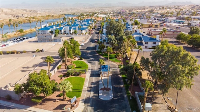 drone / aerial view with a water view and a residential view