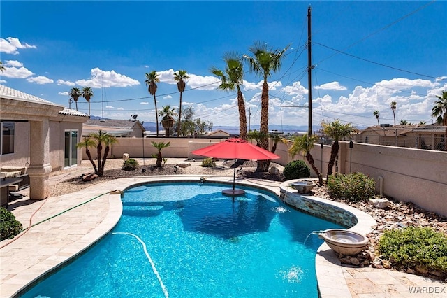 view of pool featuring a fenced backyard and a fenced in pool