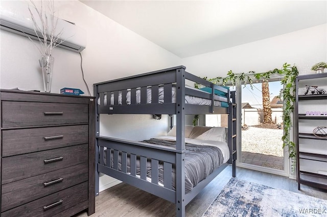 bedroom featuring wood finished floors