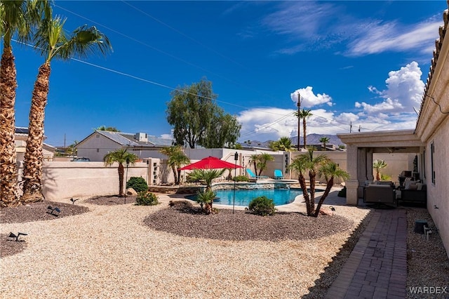 view of swimming pool featuring a patio, a fenced backyard, and a fenced in pool