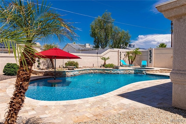 view of swimming pool with a fenced in pool, a patio, an in ground hot tub, and a fenced backyard