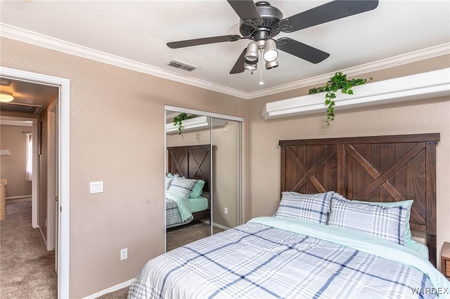 bedroom featuring crown molding, a closet, visible vents, and carpet floors
