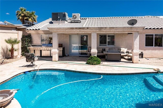 outdoor pool featuring exterior kitchen, central air condition unit, outdoor lounge area, a patio area, and fence