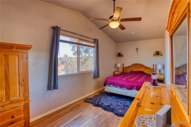 bedroom featuring vaulted ceiling, ceiling fan, wood finished floors, and baseboards