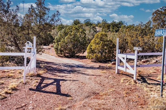 view of gate with fence