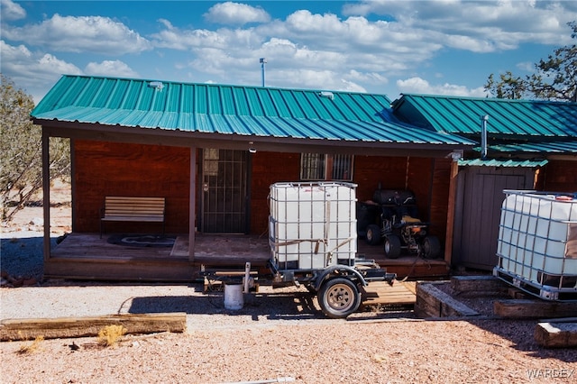 exterior space featuring metal roof