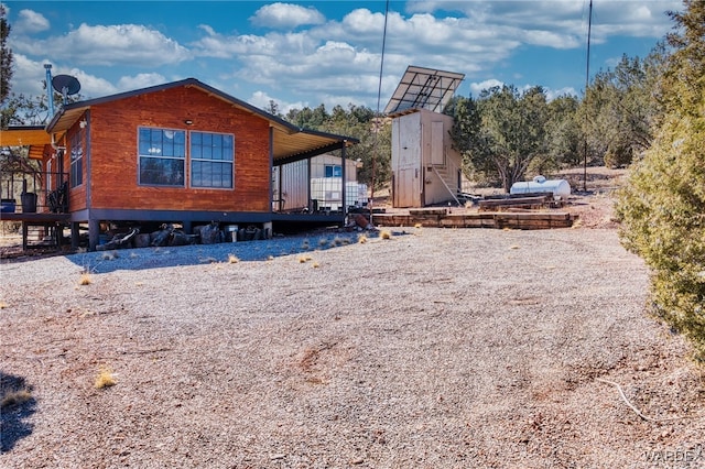 exterior space with gravel driveway