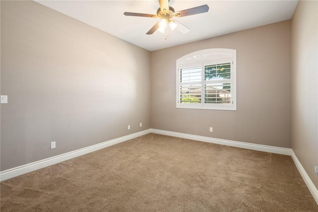 1999 Alan Ladd Dr, Kingman, AZ 86409 - carpeted spare room with baseboards and ceiling fan