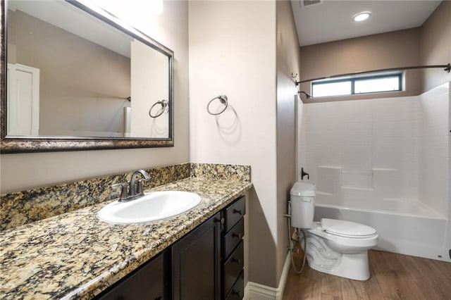 1999 Alan Ladd Dr, Kingman, AZ 86409 - full bathroom with toilet, wood finished floors, vanity, shower / tub combination, and baseboards