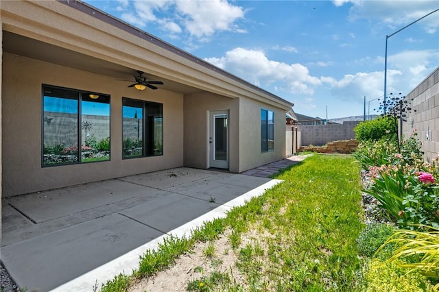 1999 Alan Ladd Dr, Kingman, AZ 86409 - rear view of property with ceiling fan, stucco siding, and a patio area
