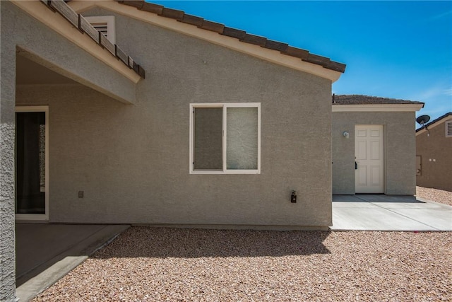 2635 Bear Mountain Loop, Bullhead City, AZ 86442 - back of property featuring stucco siding and a patio