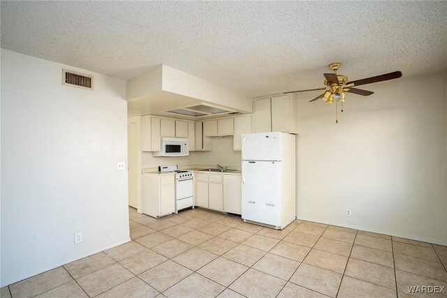 kitchen featuring ceiling fan, white appliances, a sink, visible vents, and light countertops