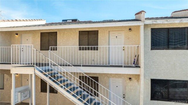 view of property featuring stairs