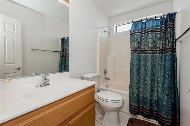 6045 S Klamath Loop, Fort Mohave, AZ 86426 - full bathroom featuring shower / tub combo with curtain, vanity, and toilet