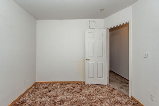 6045 S Klamath Loop, Fort Mohave, AZ 86426 - carpeted empty room with baseboards and fire sprinkler in ceiling