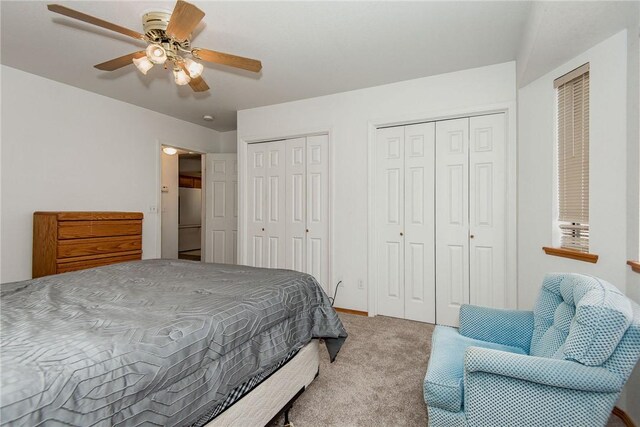 6045 S Klamath Loop, Fort Mohave, AZ 86426 - bedroom featuring carpet flooring, multiple closets, stainless steel refrigerator, and ceiling fan