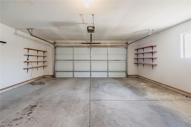 6045 S Klamath Loop, Fort Mohave, AZ 86426 - garage with baseboards and a garage door opener