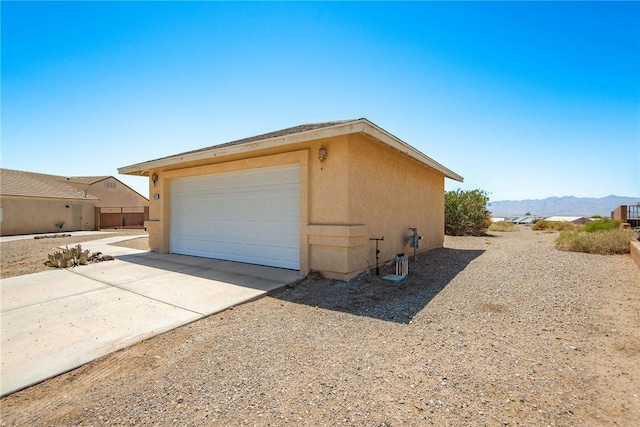 6045 S Klamath Loop, Fort Mohave, AZ 86426 - garage with a mountain view and driveway