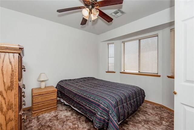6045 S Klamath Loop, Fort Mohave, AZ 86426 - carpeted bedroom with baseboards and ceiling fan