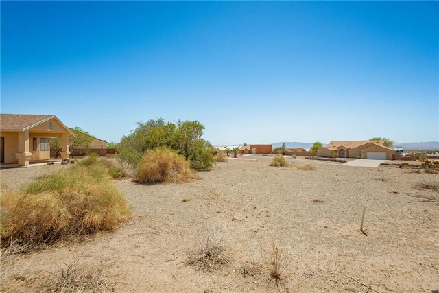 6045 S Klamath Loop, Fort Mohave, AZ 86426 - view of yard featuring a garage