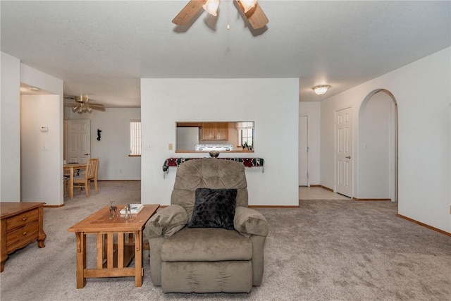 6045 S Klamath Loop, Fort Mohave, AZ 86426 - carpeted living room with a ceiling fan and baseboards