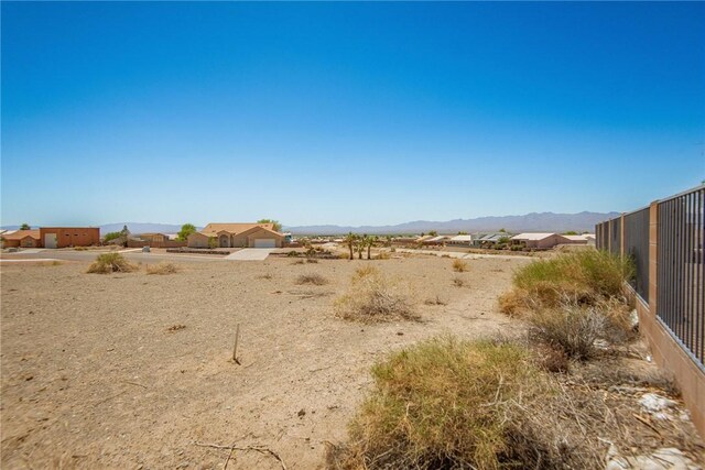 6045 S Klamath Loop, Fort Mohave, AZ 86426 - view of yard featuring a mountain view and fence