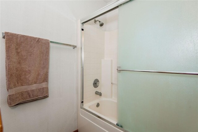 6045 S Klamath Loop, Fort Mohave, AZ 86426 - full bathroom featuring shower / bath combination with glass door