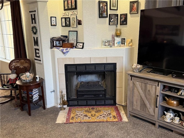 3483 Via Los Pozos, Bullhead City, AZ 86442 - living room with carpet floors, a tiled fireplace, and a textured wall