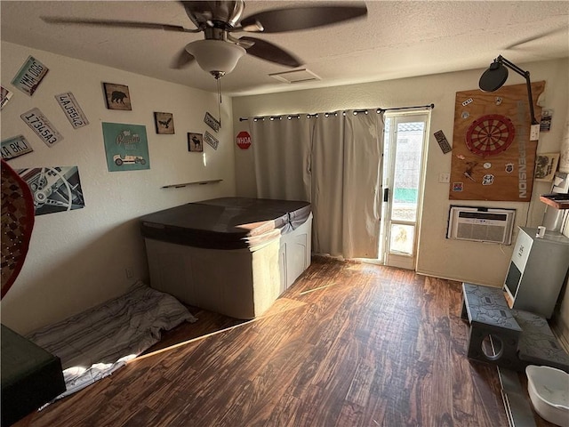 3483 Via Los Pozos, Bullhead City, AZ 86442 - kitchen featuring wood finished floors, a ceiling fan, a wall mounted AC, and a textured ceiling