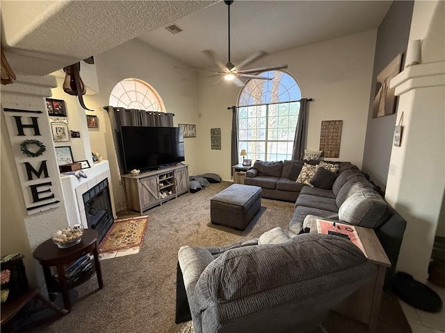 3483 Via Los Pozos, Bullhead City, AZ 86442 - carpeted living room with ceiling fan and a tiled fireplace