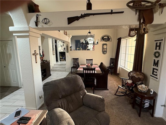 3483 Via Los Pozos, Bullhead City, AZ 86442 - carpeted living area featuring a chandelier and baseboards