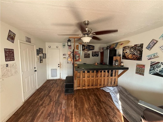 3483 Via Los Pozos, Bullhead City, AZ 86442 - living room featuring wood finished floors, ceiling fan, a textured ceiling, and a dry bar