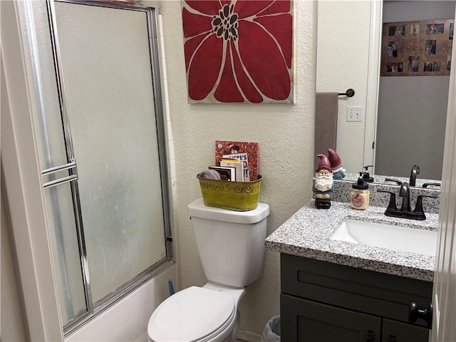 3483 Via Los Pozos, Bullhead City, AZ 86442 - bathroom featuring vanity, a textured wall, and combined bath / shower with glass door