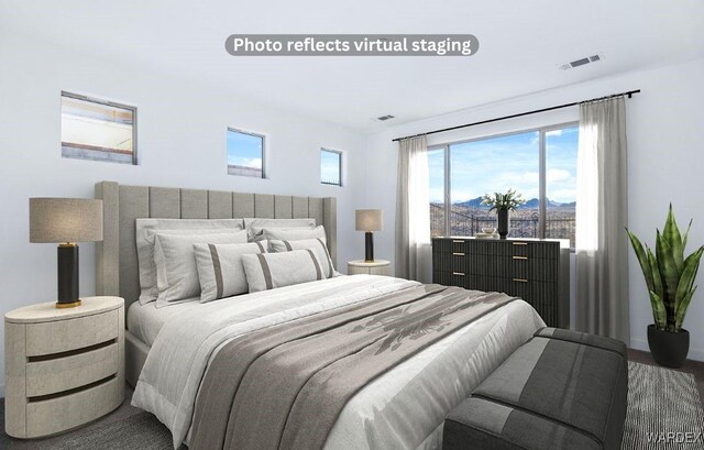 bedroom with visible vents and a mountain view