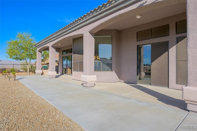 view of patio / terrace featuring fence