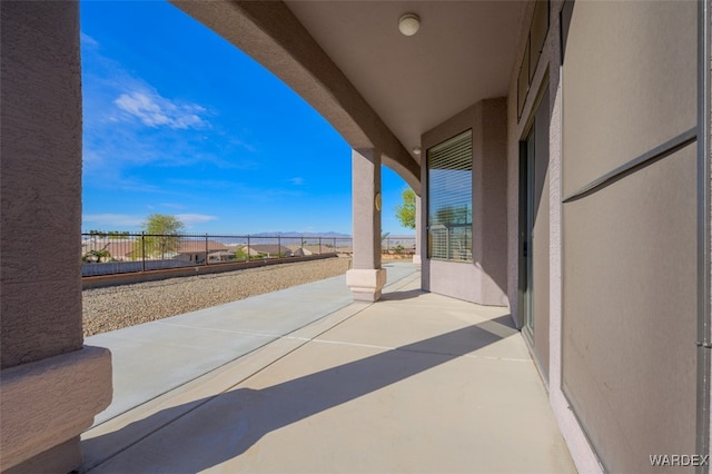 view of patio featuring fence