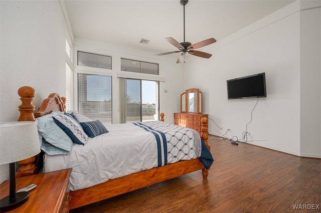 bedroom with a ceiling fan, access to outside, visible vents, and wood finished floors