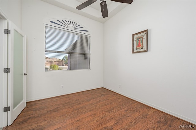 empty room featuring ceiling fan, baseboards, and wood finished floors