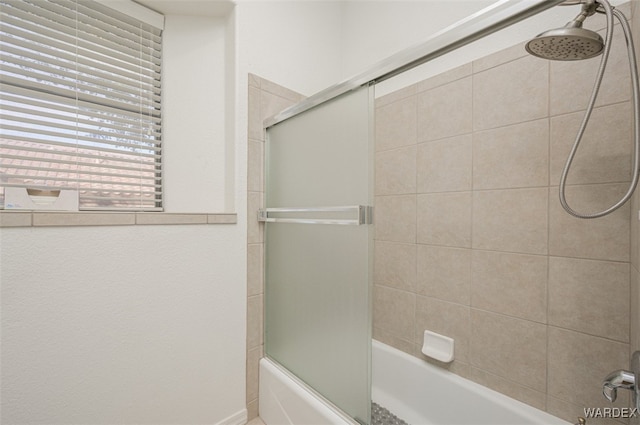 full bathroom featuring combined bath / shower with glass door