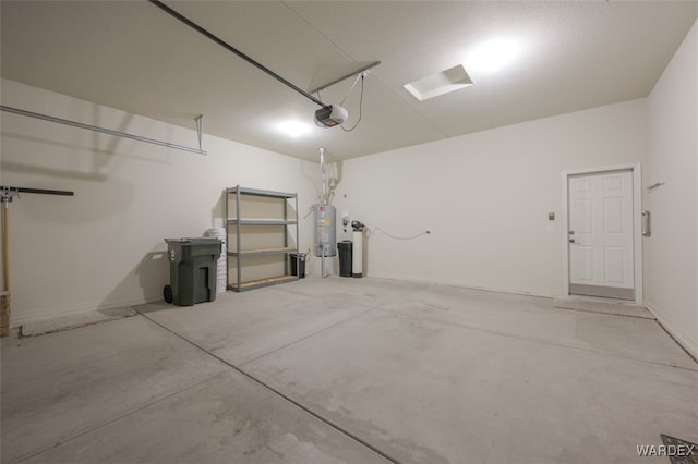 garage with water heater and a garage door opener